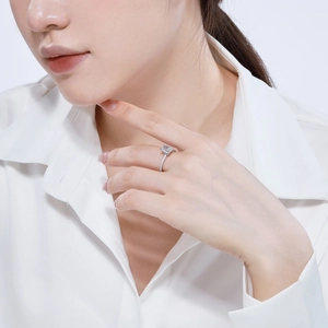 Close-up of square cut zircon S925 sterling silver ring on finger for elegant wedding style