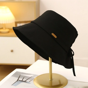 Black cotton sun hat with a gold metal logo and an elegant rear bow detail