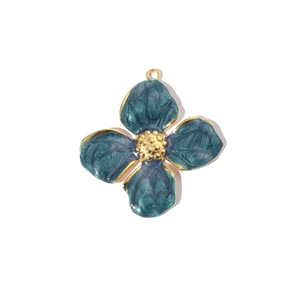 Detailed view of a blue enamel four-leaf flower pendant with gold-plated steel edges