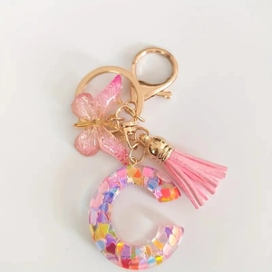 Pink glitter resin letter C keychain with pink butterfly pendant and silk tassel ornament