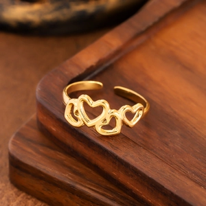 Elegant gold hollow heart ring in stainless steel with an adjustable open-band design