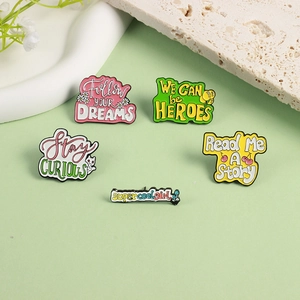 Whimsical enamel pins with cats and flowers inside motivational English quotes on green background