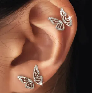 Detail showing butterfly ear cuff with silver plating and white crystals on ear