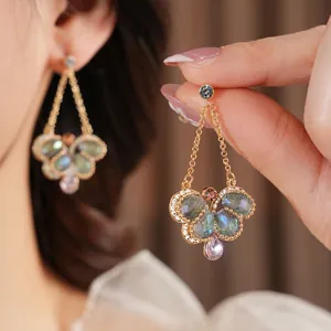 Vintage gold butterfly earrings with colorful crystal teardrops and silver needle studs