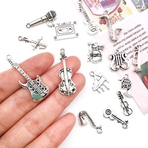 Set of retro silver musical instrument charms including guitar and violin for DIY crafts