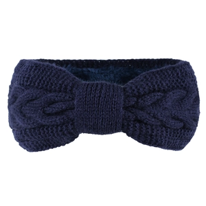 Detail view of navy blue knitted bow headband with thick fleece lining for winter warmth