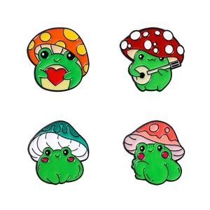 Set of four cute cartoon frog enamel pins with colorful mushroom hats and musical motifs