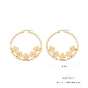 Detailed view of 4.5cm gold stainless steel hoop earrings with five clover charms