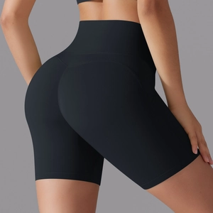 Close-up of high-waisted black yoga shorts showing the seamless butt-lifting design