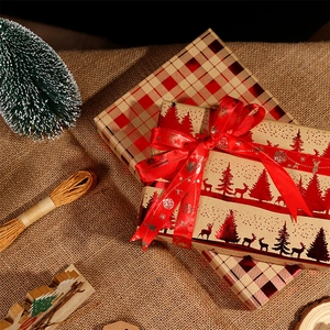 Christmas kraft wrapping paper set with red ribbons and festive reindeer tree patterns