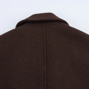 Macro shot of the back collar and shoulder seams on this brown wool coat for women
