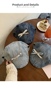 Detailed view of denim beret hats with silver bows and pink heart rhinestones
