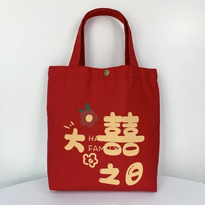 Detail of red wedding canvas tote bag with snap button and festive floral print