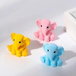 Miniature resin cartoon elephant figurines in colorful yellow, pink, and blue sitting poses