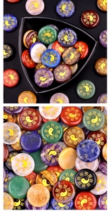 Macro detail of natural stone discs featuring golden Yin Yang Tai Chi engravings