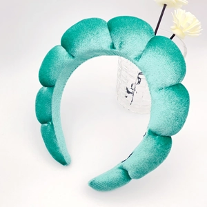 Detail view of thickened mint green velvet sponge headband with soft quilted texture