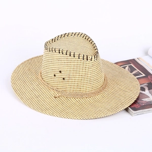 Detail of straw cowboy hat featuring breathable air holes and braided rope decoration