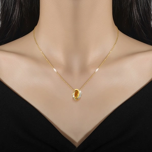 Titanium steel necklace with interlocking double rings, one gold-plated and one diamond-encrusted