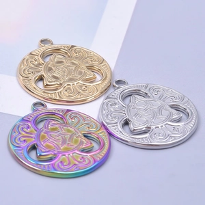 Detailed view of hollow Celtic witch knot pendants in gold, silver, and rainbow colors
