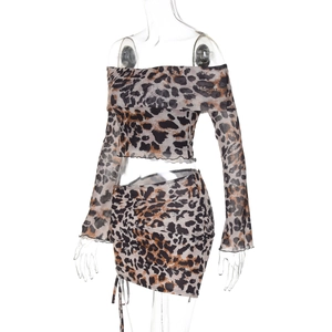 Detail of leopard print two-piece set featuring off-shoulder crop top and drawstring skirt