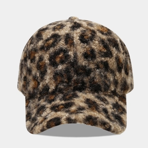 Winter faux fur leopard print baseball cap with warm plush texture and vintage curved brim