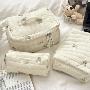 Three-piece quilted storage bag set with rabbit embroidery and soft fabric textures