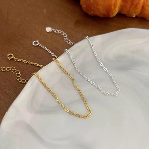 Elegant S925 sterling silver geometric link bracelets with heart charms on marble surface