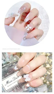 Détail de 30 faux ongles trapèze longs avec nœuds blancs 3D et accents de perles