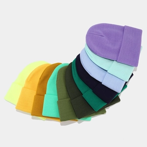 Multiple color options for knit beanies showing texture and classic cuffed design