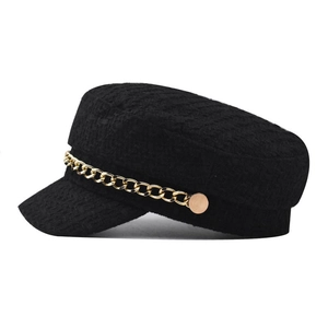 Elegant black tweed baker boy hat featuring a decorative gold chain and metallic buttons