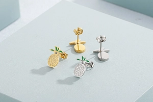 Close-up of sparkling rhinestone butterfly earrings and necklace set in polished finish