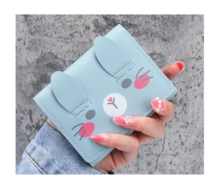 Detailed close-up of a blue cartoon rabbit short wallet featuring 3D ears and cute prints