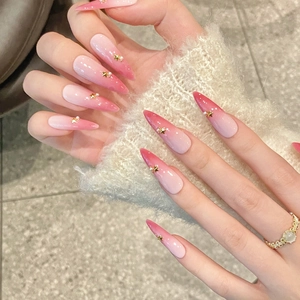Pink ombré handmade press-on nails with star and pearl charms in long almond shape