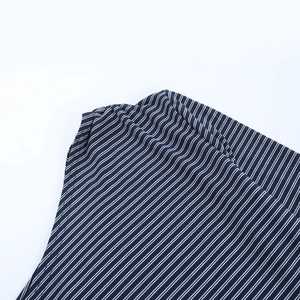 Close-up of fine navy and white striped knit fabric showing high-quality texture