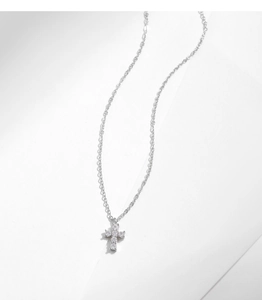 Macro detail of silver cross pendant with multiple clear moissanite stones and necklace chain