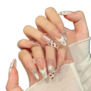 Handmade stiletto press-on nails with white lace, pearls, and cat eye crystal accents