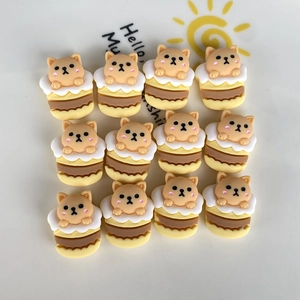 Detail of 12 mini resin Shiba Inu cake figurines for DIY crafts on a white plate