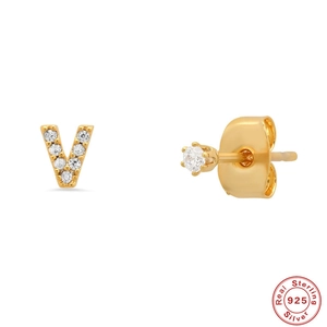 Detail view of gold S925 sterling silver V-letter stud earring with zircon stones
