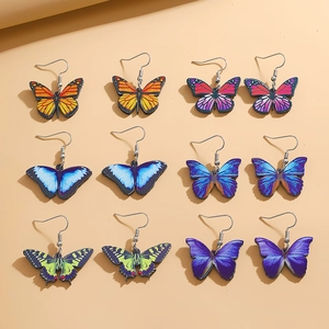 Detailed flat lay of 6 pairs colorful acrylic butterfly drop earrings set with metal hooks