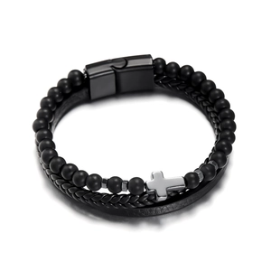 Close-up of multilayer leather bracelet with black obsidian beads and silver cross