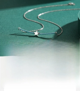 Close-up of S925 sterling silver necklace with turquoise inlaid star pendant detail