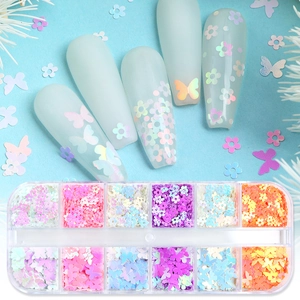 Detailed set of butterfly and flower nail art glitters in 12-grid storage box with macro view