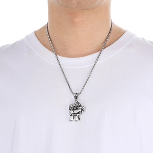 Men's silver stainless steel fist pendant necklace with box chain on white t-shirt