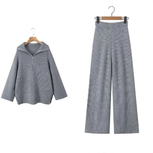 Women's grey knitted lounge set featuring lapel zip pullover and high waist wide leg pants