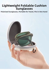Close-up of olive green foldable polarized sunglasses with gray round zipper storage case