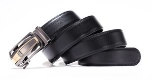 Detail of genuine leather belt with metallic automatic buckle in gunmetal and gold
