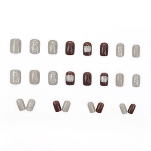 Short square press-on nails set in grey and brown with smiley face and happy girl text