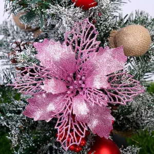 Pink glitter poinsettia flower ornament for Christmas tree and festive wreath decoration