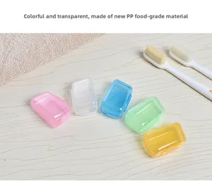 Five-piece set of colorful portable food-grade PP toothbrush head covers on a wooden surface