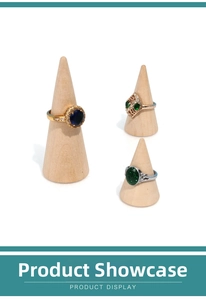Detailed view of assorted gemstone rings displayed on cone-shaped wooden ring holders